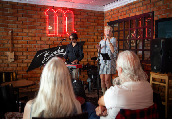 singers singing and playing keyboards